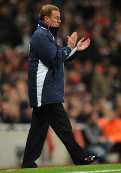 New Tottenham Hotspur manager Harry Redknapp applauds his troops during their 4-4 draw with Arsenal (PA)