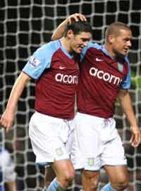 EPL: Gareth Barry receives congratulations from his Aston Villa team-mates after scoring against Blackburn. (PA)