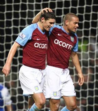 EPL: Gareth Barry receives congratulations from his Aston Villa team-mates after scoring against Blackburn. (PA)