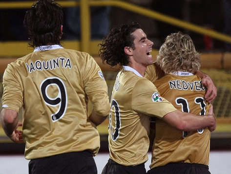 Tiago Mendes and Pavel Nedved celebrate for Juventus against Bologna.