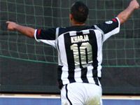 Houssine Kharja celebrates scoring the winner for Siena against Fiorentina in today's Tuscan derby.