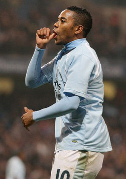 Manchester City's Robinho celebrates in that distinctly familiar style of his after scoring against FC Twente in the UEFA Cup (PA)