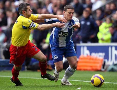 EPL: Jason Kouma - Andy Griffin, Wigan Athletic v Stoke City (PA)