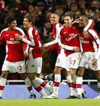 Young Gunners: Arsenal's tots celebrates one of Jay Simpson's two strikes against Wigan Athletic.