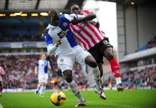 Tussle of the muscle: The sturdy pairing of Kenwyne Jones and Chris Samba clash during the Premier League tie between Blackburn and Sunderland