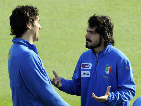Italian pair Luca Toni and Gennaro Gattuso enjoy a break in training before their friendly clash against Greece
