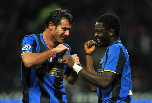 Sulley Muntari and Dejan Stakovic celebrate a hard-fought victory over rivals Juventus.