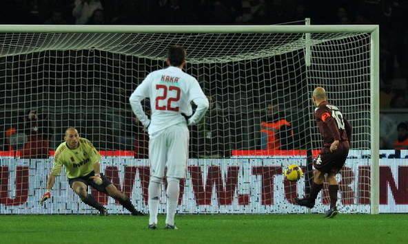 Torino's Rosina comfortably tucks home his side's equaliser agains AC Milan as Kaká watches on hapless (Grazia Neri)