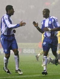 Camara Flash: Henri Camara wheels away after netting a strike for Wigan against West Bromwich Albion