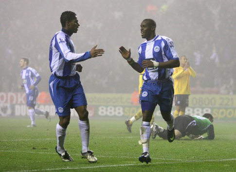 Camara Flash: Henri Camara wheels away after netting a strike for Wigan against West Bromwich Albion