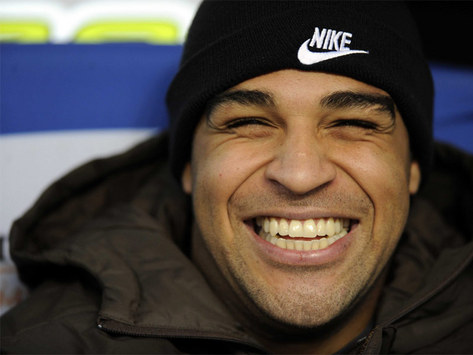 All Smiles: Despite constant rumours of a rift between he and coach Jose Mourinho, not to mention an imminent departure, Adriano looked cheery on the Inter bench this afternoon.