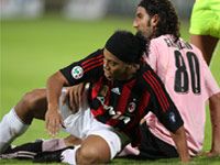 Sicilian Message: Morris Carrozzieri (Palermo) making life difficult for Ronaldinho (Milan) as the Rossoneri were humbled 3-1 by their hosts.