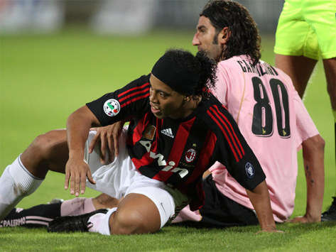 Sicilian Message: Morris Carrozzieri (Palermo) making life difficult for Ronaldinho (Milan) as the Rossoneri were humbled 3-1 by their hosts.