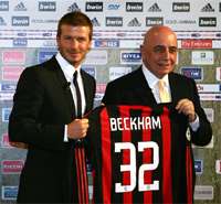 Milan bigwig Adriano Galliani does the honours as the Serie A side unveil loan signing David Beckham (PA)