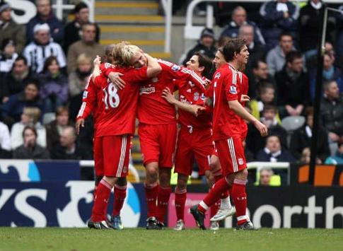 Sami Hyypia being mauled celebrating a rare goal for Liverpool against Newcastle United.