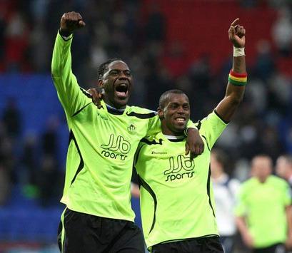 EPL: Mario Melchiot and Henri Camara, Bolton Wanderers - Wigan Athletic (PA)