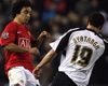 Manchester United's Rafael Da Silva and Derby County's Lewin Nyatanga avoids smashing into each other during their Carling Cup clash (PA)