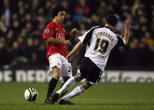 Manchester United's Rafael Da Silva and Derby County's Lewin Nyatanga avoids smashing into each other during their Carling Cup clash (PA)