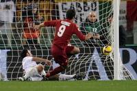 Mirko Vucinic's sweet strike ripples the back of the net during Roma's 2-2 draw with Milan (Grazia Neri)