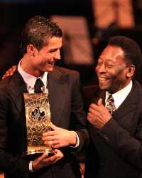 Cristiano Ronaldo recevies his FIFA World Player of the Year award from the great man himself, Pele (PA)