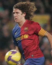 Barcelona captain Carles Puyol in the thick of the action for his side in the 5-0 thrashing of Deportivo.