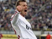 David Beckham celebrates his first goal for AC Milan in a 4-1 over Bologna.