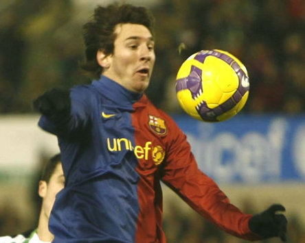 Barcelona ace Lionel Messi in action as he races down on goal