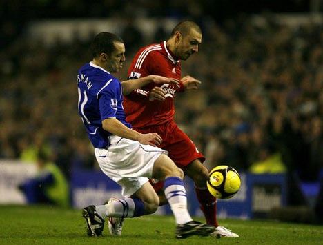 FA Cup: Leon Osman - Andrea Dossena, Everton v Liverpool (PA)