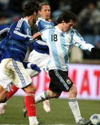 Don't mess with me! Argentina's Lionel Messi careens past a wall of French players as he helped his side to a 2-0 friendly win in Marseille