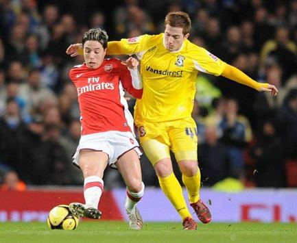 Cardiff City's Ross McCormack tries the ol' arm over the shoulder tactic but Samir Nasri would have none of it (PA)