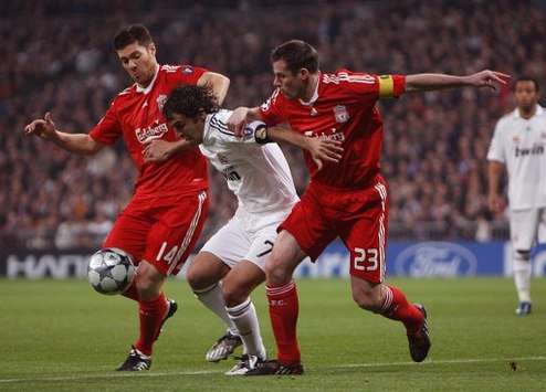 It takes two to tango as Xabi Alonso and Jamie Carragher shackle Raul at the Bernabeu