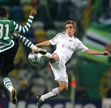 Whack! Bayern's Philipp Lahm smashes one towards goal against Sporting Lisbon