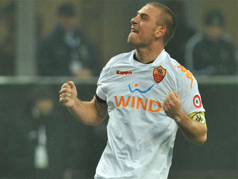 Daniele De Rossi celebrates after giving Roma the lead against Inter, but his smile didn't last very long as the game ended 3-3