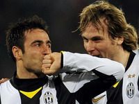 Marco Marchionni celebrates with Pavel Nedved after giving Juventus the lead against Lazio