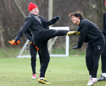 Rooney and Tevez - Playfully  - Manchester United (PA)