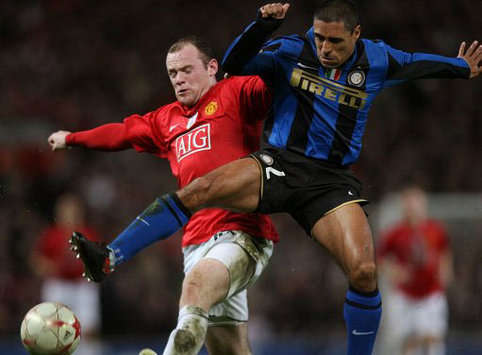 CL: Wayne Rooney - Ivan Ramiro Cordoba, Manchester United - Inter (PA)