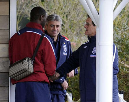 Fabio Capello and Ledley King shake hands at England training (PA)