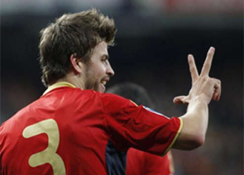 Gerard Pique celebrates after he gives Spain the lead against Turkey