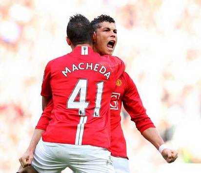 Federico Macheda hugs Cristiano Ronaldo as he draws Manchester United level against Aston Villa. The Italian was to be the hero later though.