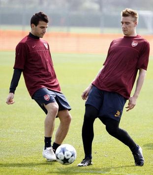 Francesc Fabregas and Nicklas Bendtner - Arsenal (PA)