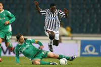 Werder Bremen captain Torsten Frings challenges Udinese midfielder Kwadwo Asamoah