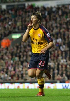 Andrey Arshavin opens the scoring at Anfield, attempting to quiet the noisy crowd.