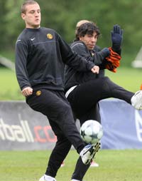 Carlos Tevez and Nemanja Vidic - Manchester United (PA)