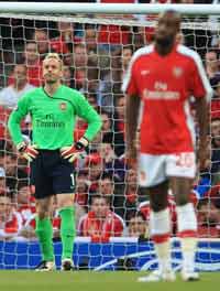 Gunned Down! Arsenal goalkeeper Manuel Almunia looks distraught after his side crash out of the Champions League to Manchester United