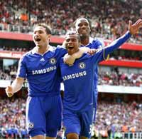Chelsea's Frank Lampard, Ashley Cole and Didier Drogba celebrate the 4-1 win over Arsenal at the Emirates
