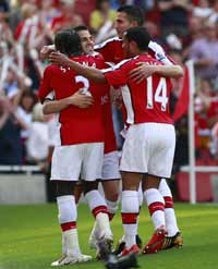 Francesc Fabregas celebrates Arsenal's 4-1 win over Stoke City on the final day of the Premier League season