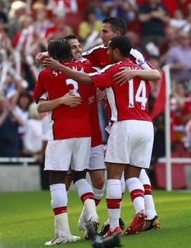 Francesc Fabregas celebrates Arsenal's 4-1 win over Stoke City on the final day of the Premier League season