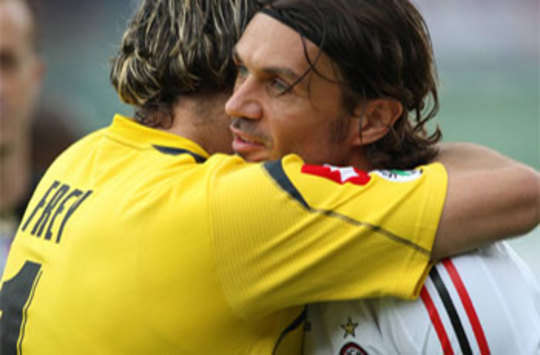 Paolo Maldini receives a farewell hug from Fiorentina's Sebastien Frey following his last ever match for Milan