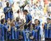 Luis Figo holds the Scudetto trophy high for Inter as he retires from football.