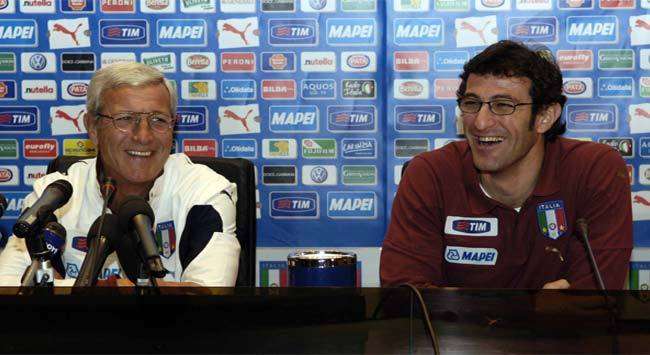 Italy coach Marcello Lippi and his assistant Ciro Ferrara share a joke during the pre-Northen Ireland friendly